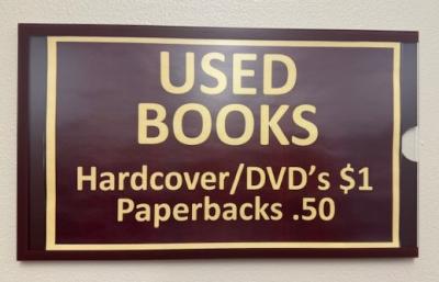 Used Book sign: hardcover/DVD's $1 Paperbacks . 50