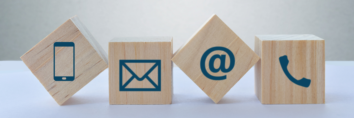 Row of wooden blocks with phone, mail, and email icons