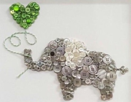 Elephant holding heart shaped balloon made with buttons on canvas.
