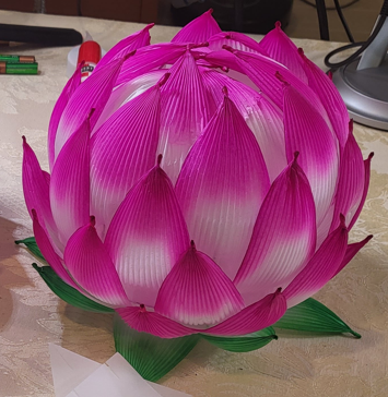 Pink lotus flower made of paper leaves. 