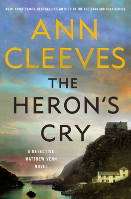 Book cover The Heron's Cry by Ann Cleeves. A seaside house set in a mountain with a cloudy sky.