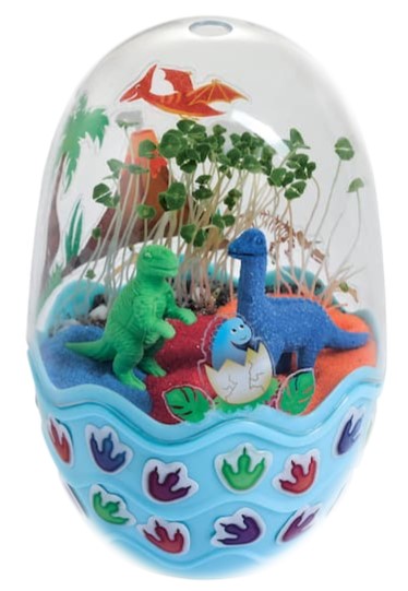 A blue mini egg garden with dinosaur figures. 