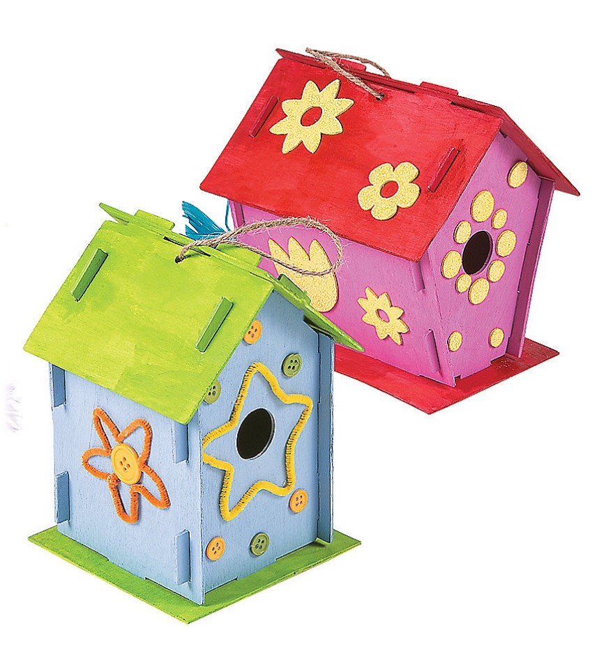 A pink and a blue wooden Pterodactyl bird house.