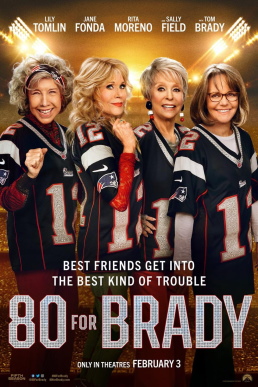 Four older women wearing matching football jerseys and smiling. 