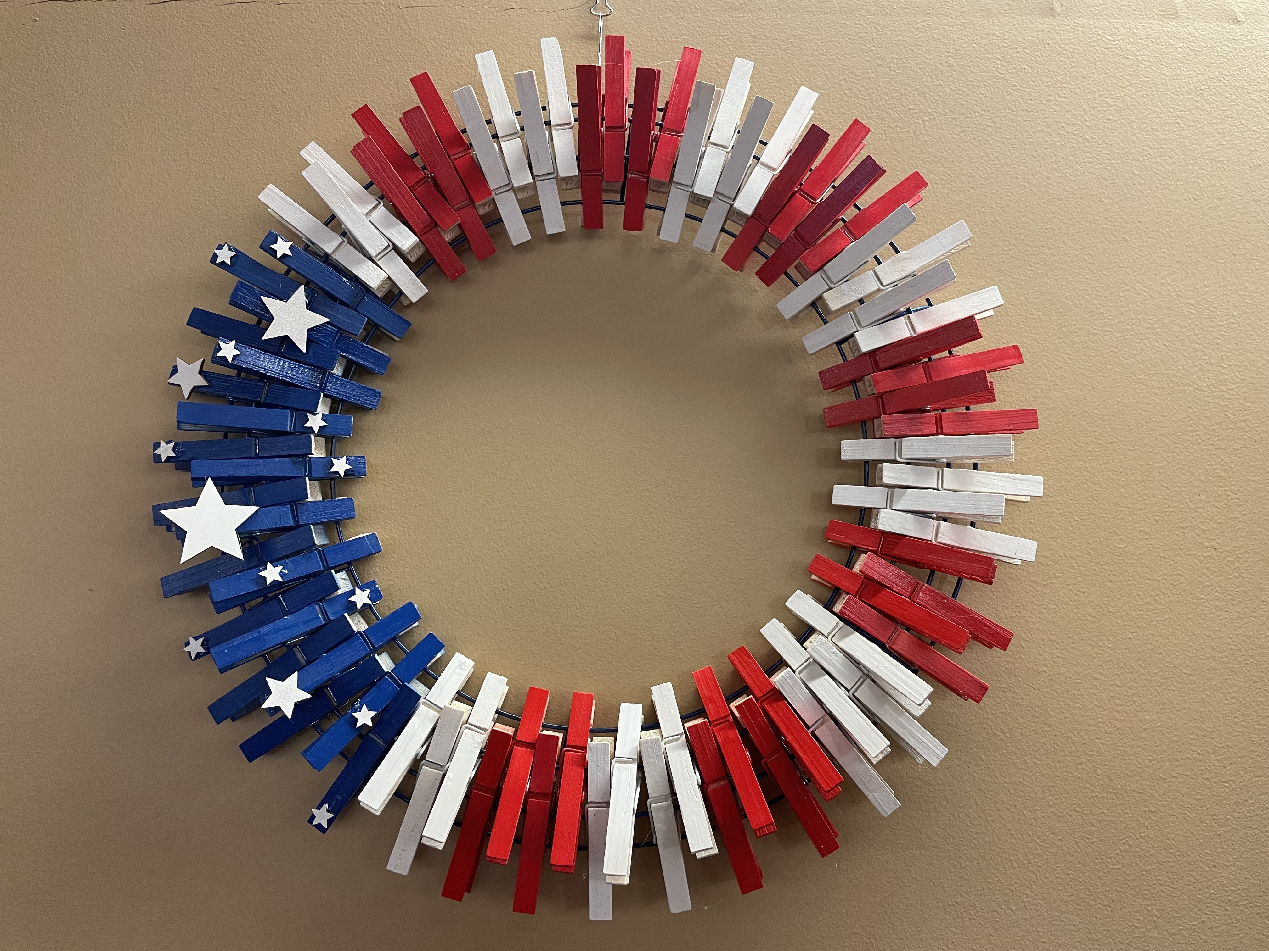 Red, white, and blue clothes pin wreath