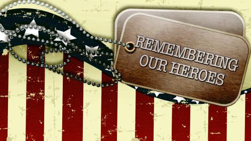 American Flags with dog tags that read Remembering Our Heroes