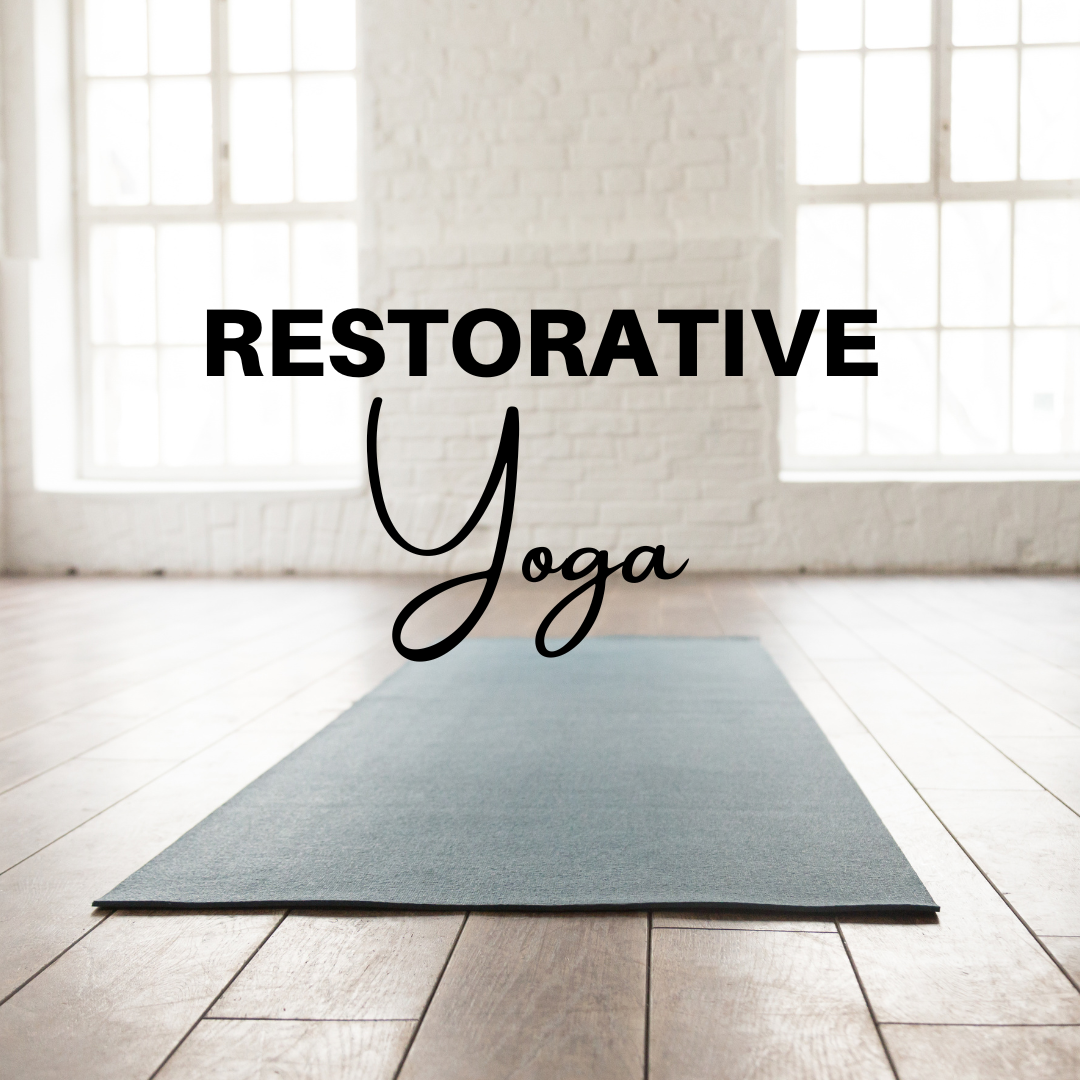 "Restorative Yoga" with blue mat on a wood floor