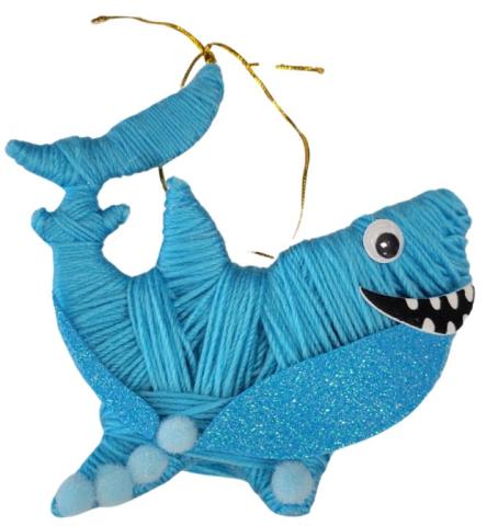 Shark wrapped with blue yarn and gold string hanger.