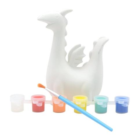 Unpainted ceramic dragon with 6 paint tubs in white, red, orange, yellow, light blue, and dark blue with a blue paint brush.