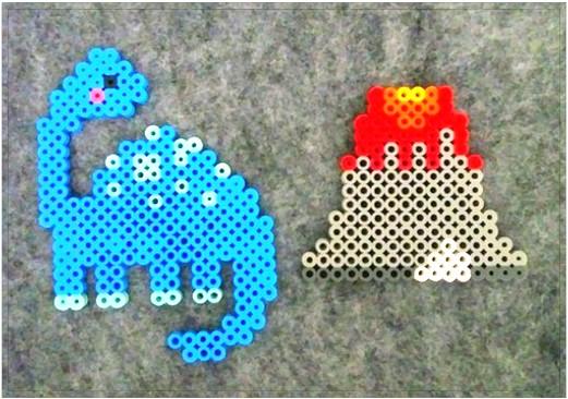 Dinosaur and volcano made with Perler Beads. 