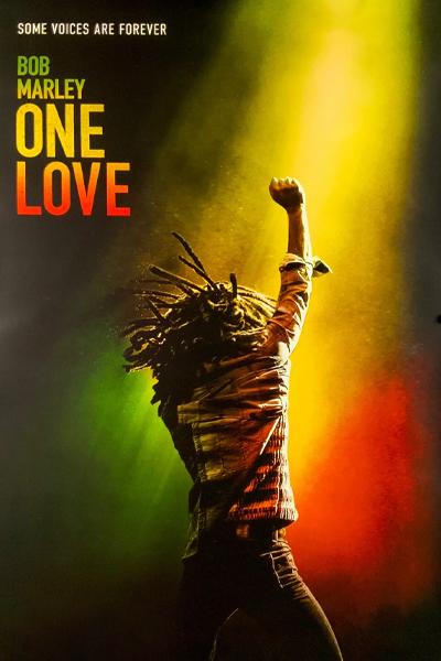 Picture of a man with on stage with his fist raised. Text reads: Bob Marley: One Love