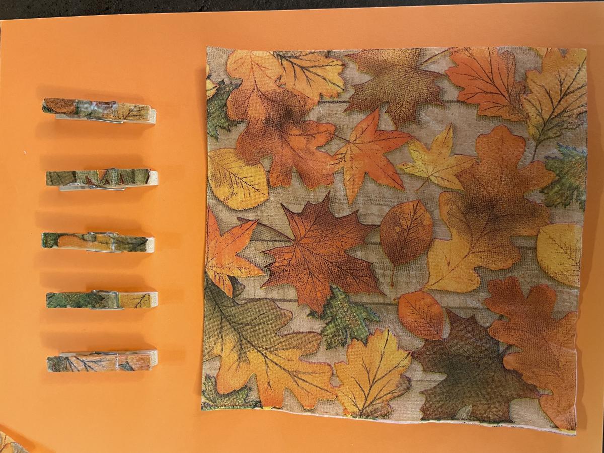 Clothes pins decorated with fall leaves