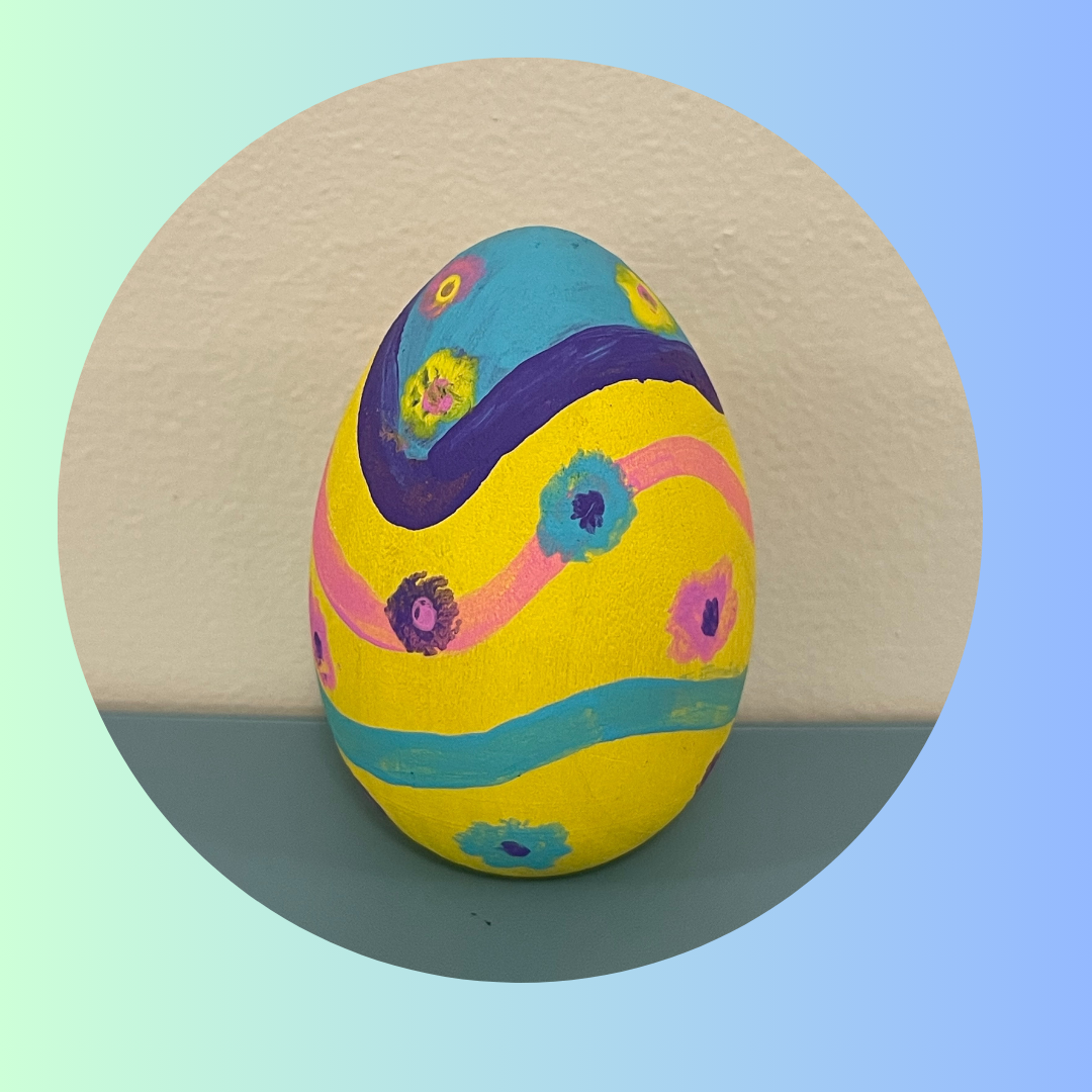 Yellow, blue, purple, green painted egg