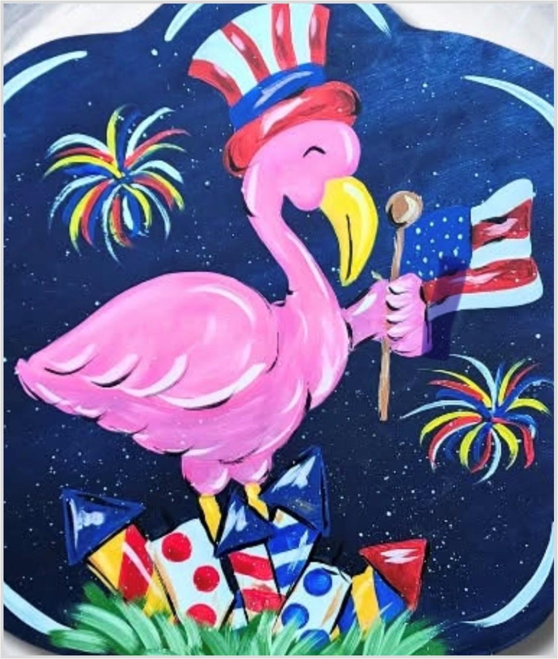 Pink flamingo in patriotic hat holding an American flag. Blue night sky with fireworks in the sky. 