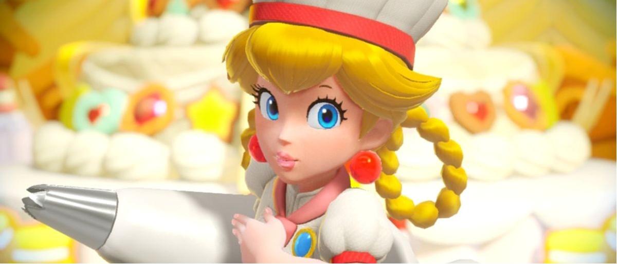 Princess Peach with blond hair in braid loops holding a pastry bag. 