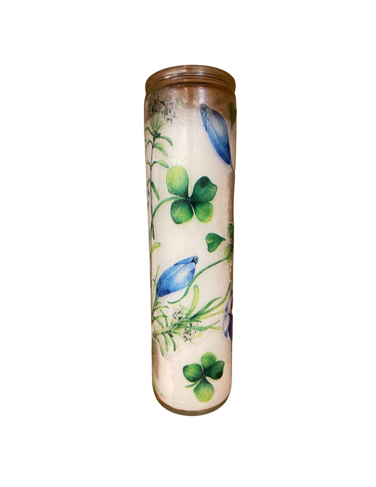 Image of a tall white candle with blue designs. 